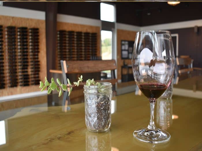 Glass of wine on a wine bar table in Walla Walla, Washington state.