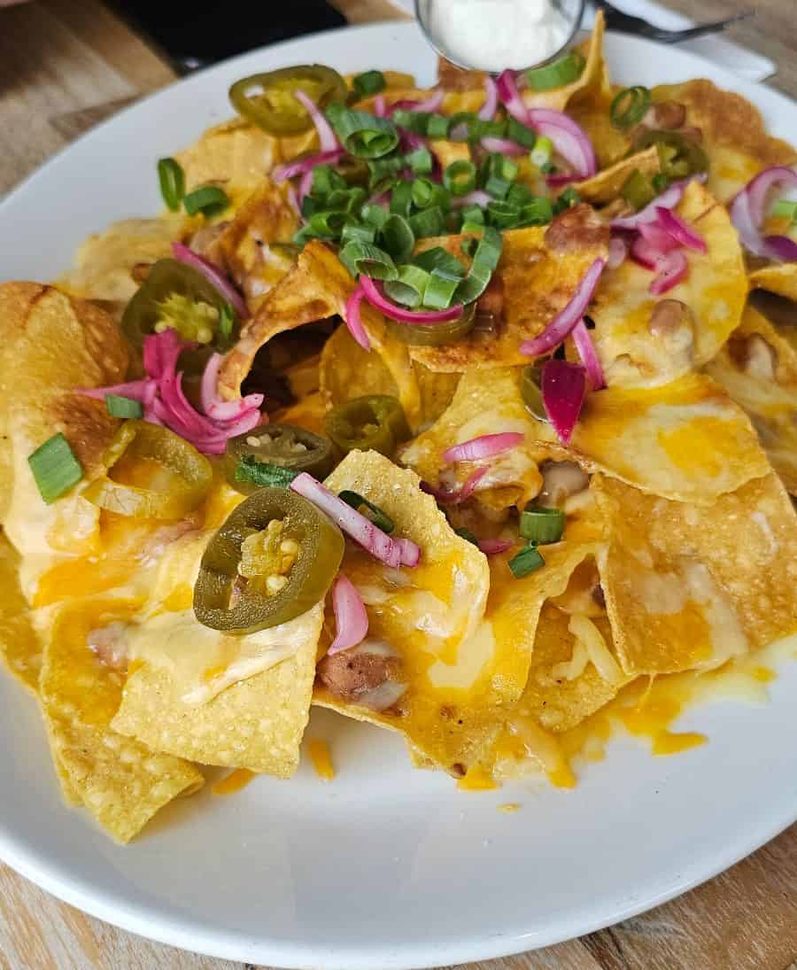 Loaded nachos with cheese, jalapeños and sour cream at Hard Rock Cafe Warsaw one of my favourite places to eat in Warsaw.
