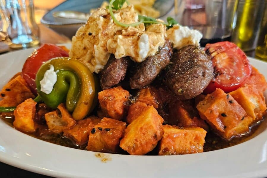La Cantina special dish with lamb, roasted vegetables and tomato sauce with pida in Warsaw