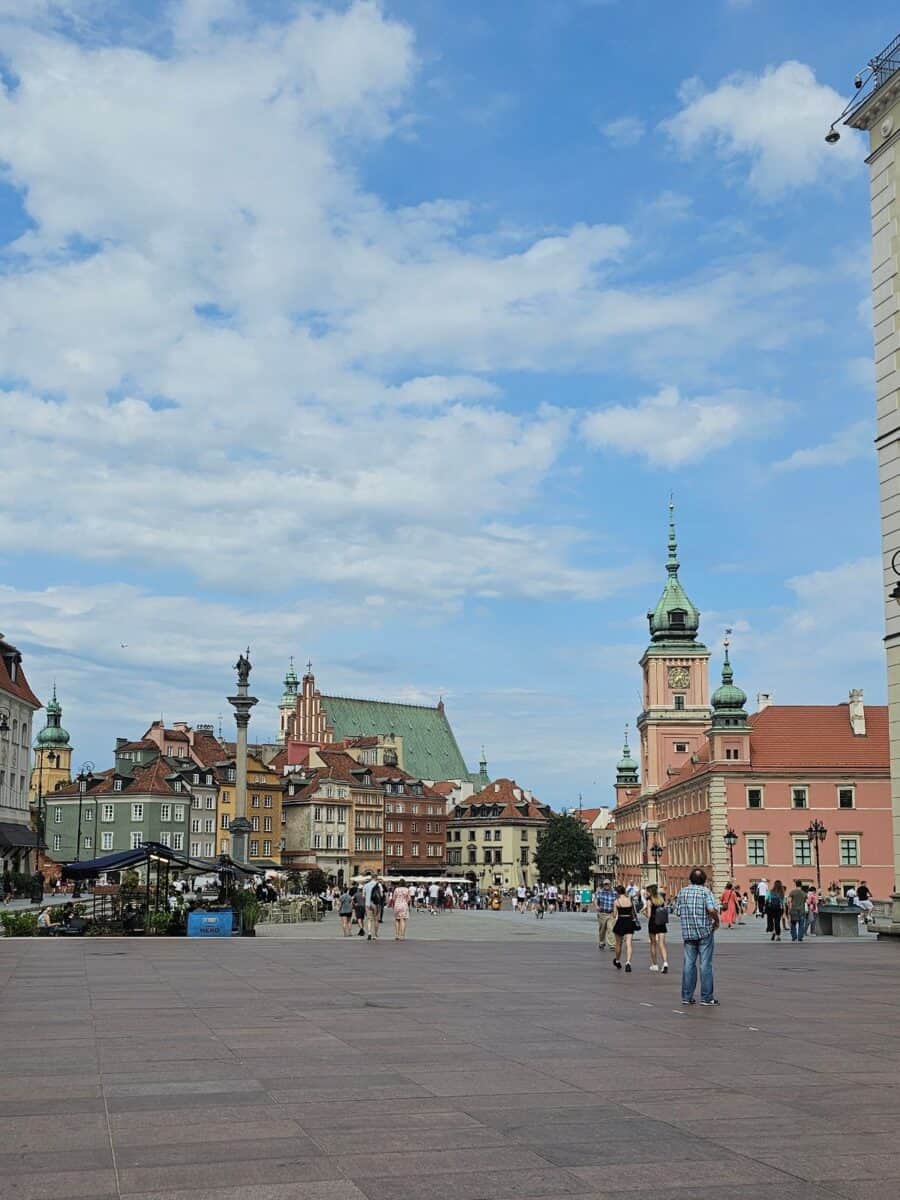 Castle Square in Warsaw with the Royal Castle, Sigismund’s Column and colourful historic buildings.